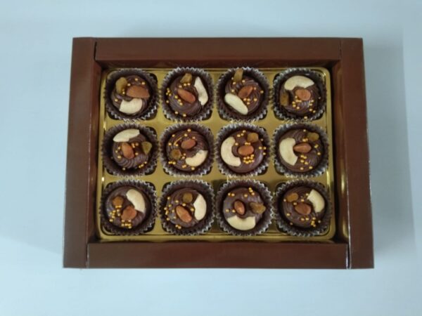 ChocoMousse Bites: Bite-sized chocolate cups filled with creamy mousse and topped with crunchy dry fruits.