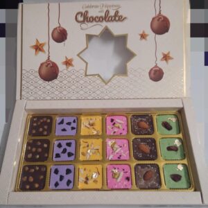 Premium Assorted Chocolate Box: 18 chocolates in 6 flavors—Butterscotch, Blueberry, Rasmalai, Rose, Almond, and Paan. A perfect luxury treat.