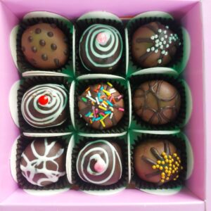 Assorted Chocolate Truffle Box (9 pcs) featuring a delicious mix of milk and dark chocolate truffles, elegantly arranged for gifting or indulgence